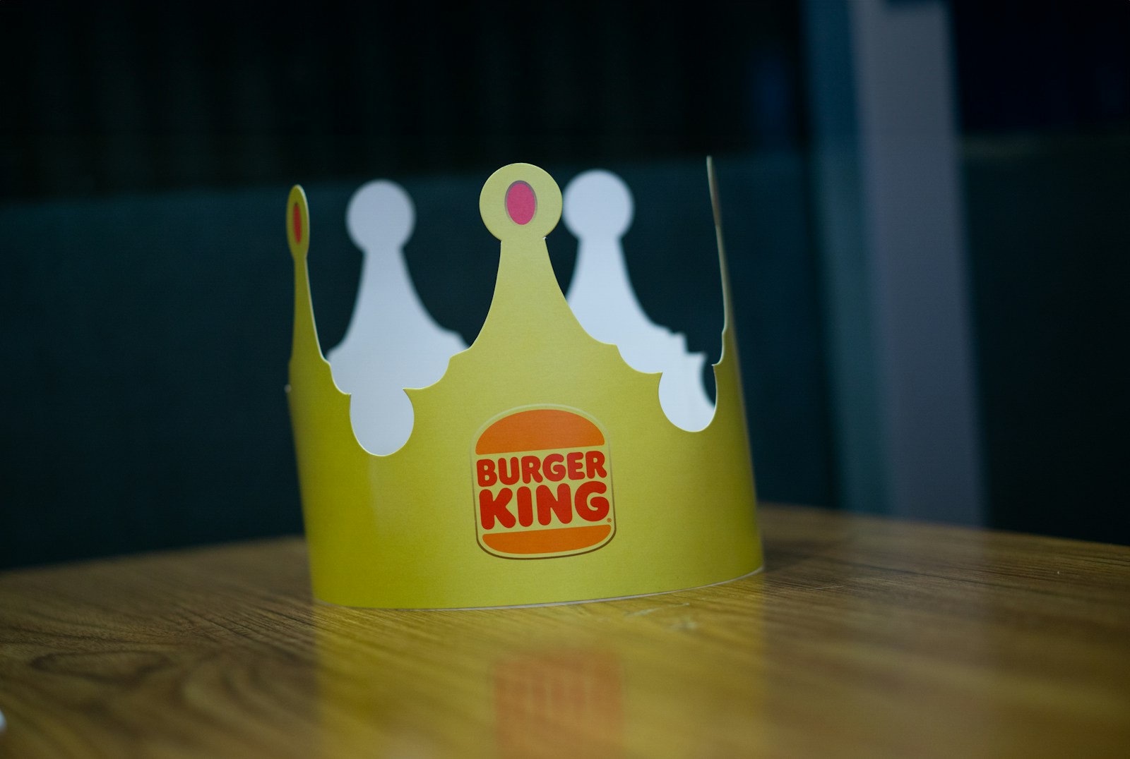 a paper crown sitting on top of a wooden table